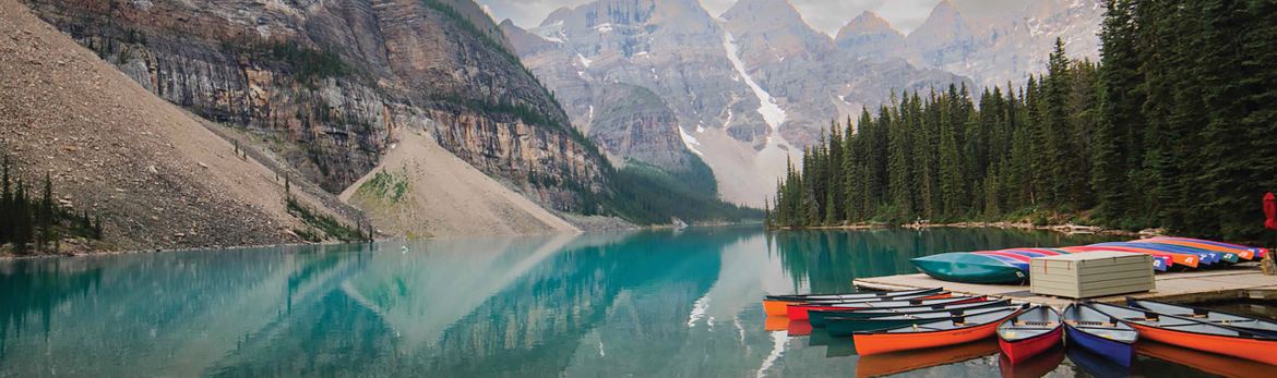 Mountains, water, and canoes lanscape