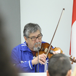 Métis Elder Oliver Boulette playing the fiddle