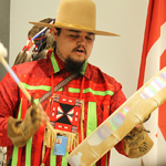 Payel Laceese, Tsilhqot'in Cultural Ambassador, playing a song on a traditional drum