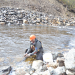 Joe Marquardson returning fish to creek.